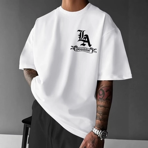 Men's white crewneck T-shirt with black Gothic lettering print in street fashion style