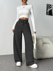 Macro shot of dark grey high waisted wide leg trousers with adjustable drawstring detail