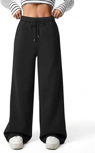 Close-up of adjustable elastic drawstring waistband and side pockets on black trousers