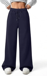 Detail view of navy blue high-waisted wide-leg sweatpants with adjustable drawstring waist