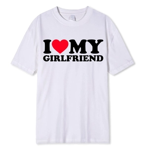 Close-up of white cotton T-shirt neckline with size M tag and gothic graphic print