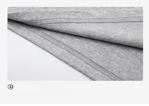 Detail of grey cotton T-shirt featuring high-quality double-needle stitching on the hem