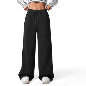 Women's black high-waisted wide leg yoga pants with adjustable drawstring waist and pockets