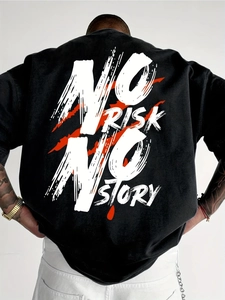 Close-up of the back print NO RISK NO STORY on a black Harajuku style oversized t-shirt