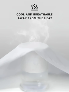 Macro shot demonstrating the high breathability and cooling effect of white cotton fabric