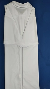 Detail of white polo shirt featuring breathable knit texture and ribbed collar design
