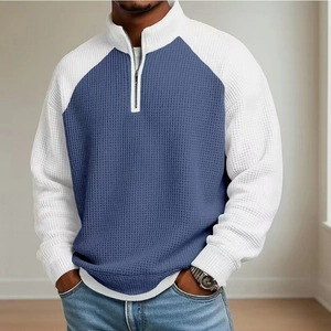 Polo homme en maille gaufrée avec demi-zip et design color-block bleu et blanc
