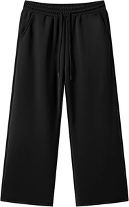 Dettaglio dei pantaloni larghi neri con elastico in vita con coulisse e tessuto di cotone liscio