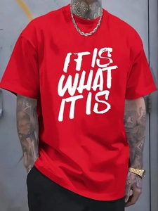 Close-up of red crew neck t-shirt with white IT IS WHAT IT IS text and cotton fabric
