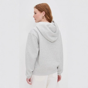 Back view of light grey drop shoulder hoodie with large hood in soft cotton fabric
