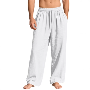 Detail of men's white linen pants featuring a drawstring elastic waist and side pockets