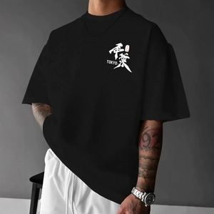 Hip hop style black cotton T-shirt featuring Tokyo graphic print in a loose fit