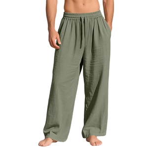 Detail view of sage green linen pants showing drawstring waist and breathable fabric texture