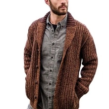 Detail of chunky knit texture and lapel on a dark brown men's winter cardigan