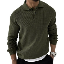 Detailed close-up of olive green waffle knit texture and three-button polo collar design