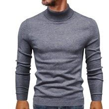 Close-up of fine rib knit texture on crewneck cuffs of the monster jacquard sweater