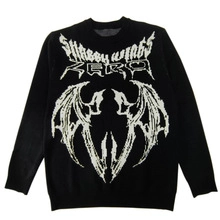 Detail of Gothic Shabby Wings print and Zero bat graphics on a black knit sweater