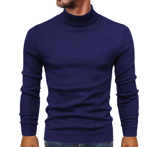 Detailed view of the ribbed turtleneck collar and cuffs on this slim fit navy blue sweater