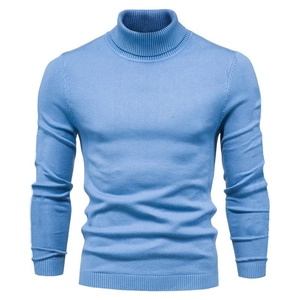 Close-up detail of light blue men's turtleneck sweater with ribbed cuffs and hem