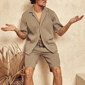 Detail shot of men's summer striped shirt and shorts set with textured fabric and lapel