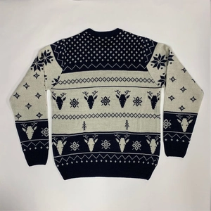 Detail of navy blue Christmas knit sweater featuring white reindeer and snowflake patterns