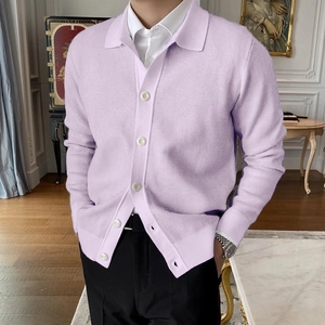 Detailed view of lavender knit cardigan buttons and ribbed cuffs on male model