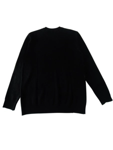 Close-up of fine-knit texture on a black long-sleeve crewneck sweater for men