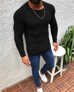 Detail of slim fit black sweater with mixed knit textures and classic round neck