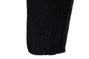 Detailed close-up of ribbed cuffs and knit texture on this black men's cardigan