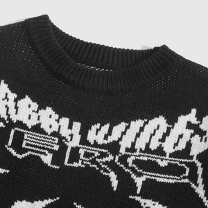Detail of crew neck ribbing and jacquard ABBY WINGS lettering on knit sweater