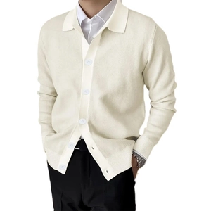 Men's cream knit cardigan with classic lapel and buttons over white shirt and black trousers