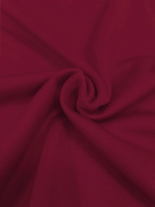 Detailed close-up showing the premium wine red fabric texture and weave of the men's polo shirt