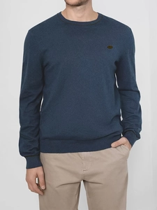 Detailed close-up of ribbed crew neck and navy blue knit texture on men's pullover