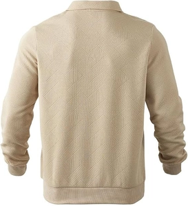 Macro shot of beige basket-weave knit texture on long-sleeve polo shirt with ribbed hem