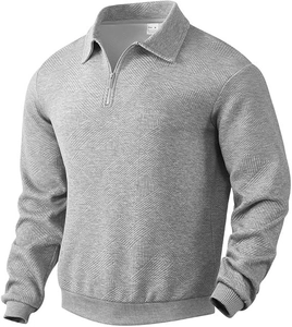 Close-up of light gray men's polo shirt featuring zipper collar and diamond knit texture