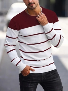 Detail of men's crewneck sweater with wine red color blocking and striped knit patterns