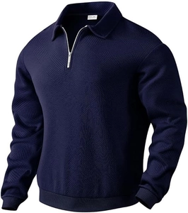Detail of navy blue men's polo shirt featuring geometric twill texture and 1/4 zipper