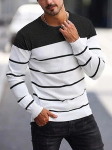 Detail of men striped crewneck knit sweater showing ribbed cuffs and fine fabric texture