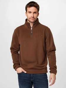 Detail of men's brown polar fleece sweatshirt with standing collar and 1/4 zipper closure