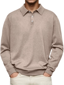 Detail of oat-colored knitted polo sweater showing button placket and ribbed hem texture