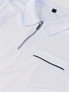 Detailed macro view of white polo shirt fabric with silver zipper and pocket detail