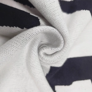 Men's crewneck knit sweater featuring classic black and white wide stripes in a soft fabric