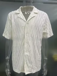 Detail of white short sleeve shirt with waffle wave texture and a classic Cuban collar