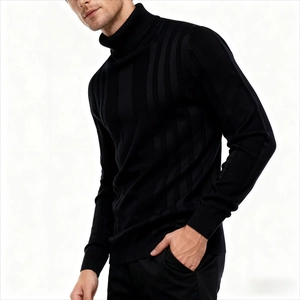 Detail shot of men's black turtleneck sweater showing vertical ribbed texture and slim fit