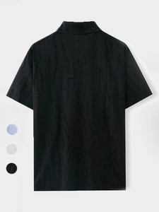 Detail of black polo shirt back with vintage vertical brushed texture and distressed holes