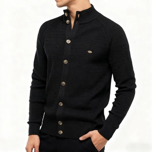 Detail of black men's knit cardigan featuring a stand collar and brown marble buttons