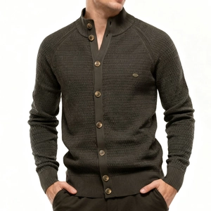 Detail of olive green men's cardigan featuring waffle knit texture and ribbed stand collar