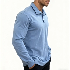 Detail of light blue knit long sleeve Polo shirt with classic collar and button placket