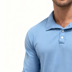 Detail of light blue Polo shirt featuring classic polo collar and white buttons