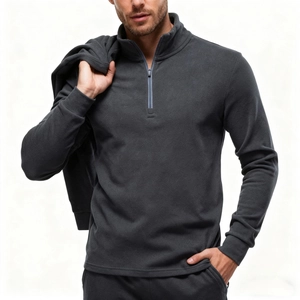 Detail view of charcoal gray half-zip sweatshirt with stand collar and ribbed cuffs texture